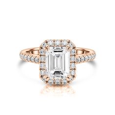 an emerald cut diamond engagement ring set in yellow gold