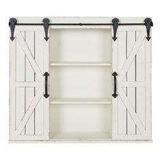 an open white cabinet with black handles and two sliding doors on the front, one door closed