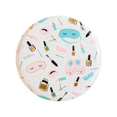 a white plate with various makeup items on it