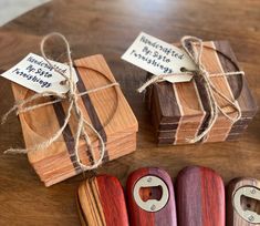 three wooden boxes tied with twine on top of a table next to each other