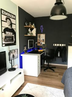 a bedroom with black walls and white furniture