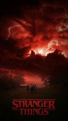 a movie poster for the film strange things with people standing in front of an ominous sky