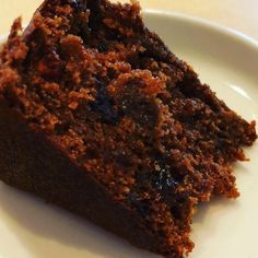 a piece of chocolate cake on a white plate