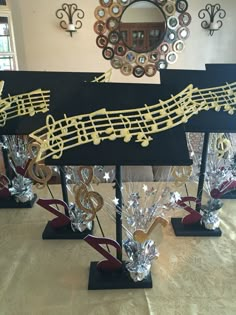 musical notes and trebles are on display in front of a mirror with other decorations