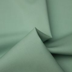 a close up shot of the fabric in light green color, which is very soft