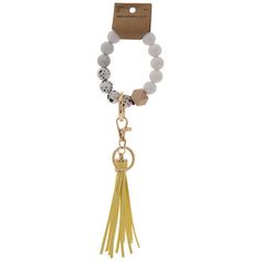 a bracelet with beads and tassels hanging from it