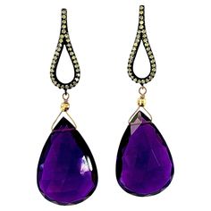 Description Large Amethyst faceted drops 44ct, Pave diamond Black Rhodium sterling silver earrings, contrasted with yellow gold. Item # E3067 Materials and Weight Amethyst, 26 x 28 mm, 44 carats, drop shape. Pave diamonds. Posts and jumbo backs, 14k gold. Dimensions Earring length: 2.25 inches. Made in Newport Beach, California. USA White Diamond Earrings, Edgy Earrings, Pave Diamond Earrings, Newport Beach California, Contemporary Earrings, Sparkly Jewelry, Unique Diamonds, Diamond Drops, Beach California