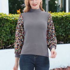 Elevate your style with the Anna-Kaci Women's Sequin Puffed Long Sleeve Mock Neck Pullover, a fashionable and elegant top adorned with glittering sequins. Perfect for parties, holidays, dates, Christmas, concerts, and any special event, this pullover adds a touch of glamour to any outfit. Fitted Balloon Sleeve Winter Tops, Stretch Long Sleeve Sequin Blouse, Fitted Balloon Sleeve Tops For Winter, Stretch Long Sleeve Blouse With Sequins, Winter Long Sleeve Sequin Top, Trendy Fall Blouse With Sequins, Trendy Lantern Sleeve Tops For Winter, Trendy Sequined Blouse For Fall, Fall Stretch Balloon Sleeve Tops