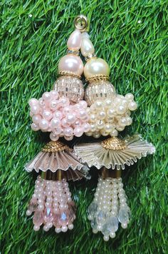 Indian Handmade Latkan Tassels for Saree Blouse Lehenga HandBags Hangings Dupatta Decoration Bridal Wedding dress for Women pair of 2 pcs Size - 11.00 cm Length  Item Description You can use this Beautiful pair of tassle for several DIY projects.  *These beautiful Tassel Latkans are used as the accessory for saree blouse on the back, but u can use according to your need and your innovative ideas. * Package contains 2 Latkan / 1 Pair Other Than Saree Blouse, you can use these latkans in various ways Craft Projects Designing Home Decoration Festive celebrations. Evening and party Apparels. Home décor items Apparel & Fashion Scarves n Stoles Headband, hats Table cover, curtains, Pillow covers, Cushion cover Shoe designing Headband, hats Table cover, curtains Designing stylish blouses Ship Fro Luxury Latkans Chandelier Earrings, Cheap Festive Latkans Earrings, Traditional Luxury Chandbalis With Latkans, Luxury Saree With Latkans, Luxury Multicolor Chandbalis With Latkans, Luxury Festive Latkans Jewelry, Latkan For Lehenga Handmade, Luxury Latkans Danglers, Luxury Chandbalis With Latkans For Celebrations