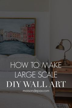 a bedroom with white walls and a painting on the wall above it that says how to make large scale diy wall art