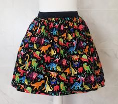 Dinosaurs Skirt Gathered  full skirt made from a beautiful 100% cotton, dinosaur fabric. Each skirt is made by gathering the fabric onto  a 2 inch black elastic waistband. The length measures from the top of the waistband and comes in three lengths, 19", 22" or 25". Please choose length from the drop down menu. The waist measurement can be seen in the measurement guide below. Please choose waist size from the drop down menu. The skirt is pictured with a petticoat to show its potential fullness, Dinosaur Skirt, Rockabilly Skirt, Dinosaur Fabric, Patterned Skirt, Quirky Fashion, Waist Measurement, Gathered Skirt, Skirt Pattern, Full Skirt