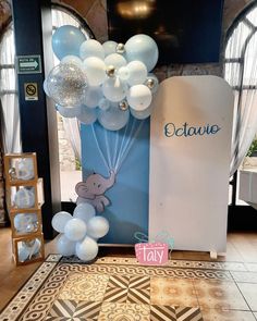 balloons are in the shape of animals on display at a baby's first birthday party