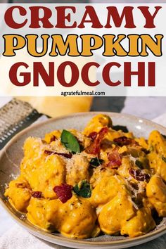 creamy pumpkin gnocchi with spinach and bacon in a cream sauce on a plate