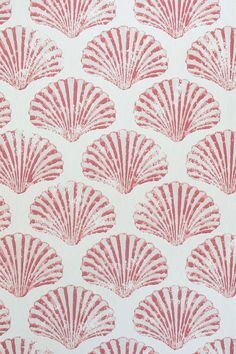 a red and white wallpaper with pink scallops on it