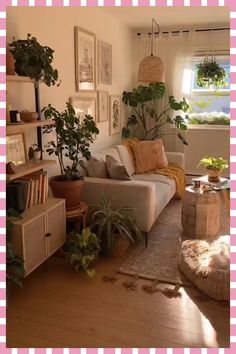 a living room filled with furniture and lots of plants