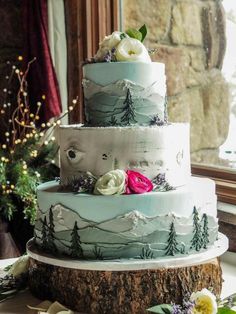 a three tiered cake sitting on top of a table