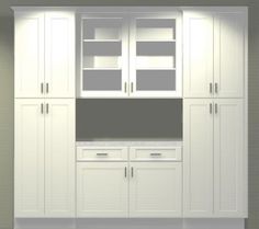 an image of a kitchen setting with white cabinets and cupboards on the side wall