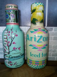 two old fashioned tea bottles sitting next to each other