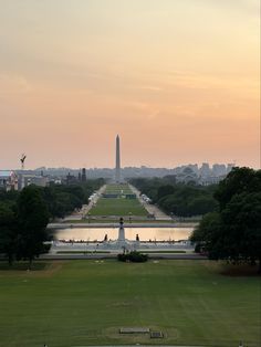 the washington monument and reflecting pool at sunset