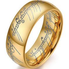 the lord's ring is shown in gold with handwritten writing on its surface