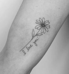 a flower with the words i love you tattooed on it's arm, in black and white