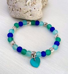 Blue and green glass beads bracelet Free Shipping This elegant bracelet is made of blue and green glass beads. Glass is a beautiful pure colors,beads have diameter 6 mm. Blue pendant is heart of shells. It is ideal for everyday wear. If you love color,this bracelet is for you:) Thank you! Blue Beaded Bracelets With Heart Beads, Blue Beaded Heart Bracelet, Blue Heart Beaded Bracelet With Round Beads, Blue Heart Bracelet With Round Beads, Blue Heart And Round Beads Bracelet, Blue Heart-shaped Beaded Bracelets With Colorful Beads, Adjustable Blue Heart Bracelet With Round Beads, Blue Heart-shaped Bracelets With Colorful Beads, Glass Beads Bracelet