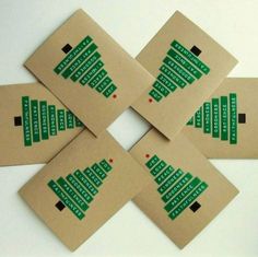 four pieces of brown cardboard with green designs on the sides and black dots in the middle