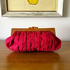 CROSS POSTED and in person at my Vintage Booth.  A prompt refund will be given if item has already been sold.  Thank you for understanding.  Cute 70s Hong Kong red canvas pleated clutch with tan plastic top.  Great bag! DESCRIPTION: Good Condition  70s Era Tan marbled look plastic and red cotton canvas fabric Snap closure at top Roomy inside, no lining Attached zippered change purse Clean inside FLAWS: **fading on red fabric edges, light dirt marks on edges (no one would notice) LABEL:  Hong Kong tag MEASUREMENTS: Bag Height:  7-1/2" Length:  13" Width:  1"  but can expand Ground Advantage shipping in USA.  Returns NOT Accepted. 70s Accessories Purse, 70s Hong Kong, Purse Cleaning, Vintage Booth, 70s Era, Red Canvas, Cotton Canvas Fabric, Change Purse, Red Fabric