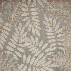 an area rug with leaves on it