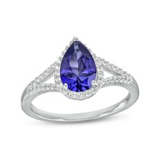 Bring royal color to any look when you wear this pear-shaped blue and white lab-created sapphire frame split shank ring in silver. Fashioned in sterling silver This choice glistens with a 9.0 x 6.0mm pear-shaped bright blue lab-created sapphire at the center. White lab-created sapphires line the halo frame and the ribbons of the split shank for added shimmer. Blue sapphire is the traditional birthstone for September and symbolizes truth, sincerity and commitment. Teardrop Sapphire Ring With Accent Stones For Formal Events, Formal Teardrop Sapphire Ring With Accent Stones, Elegant Teardrop Ring With Gemstone Accents, Elegant Teardrop Rings With Gemstone Accents, Sterling Silver Teardrop Jewelry With Center Stone, Formal Teardrop Birthstone Rings, Formal Teardrop Silver Sapphire Ring, Teardrop Center Stone Jewelry, Formal Pear Shaped Birthstone Ring