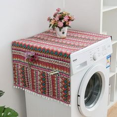 a white washer sitting next to a dryer in a room