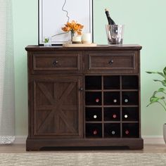 a wooden cabinet with wine bottles in it and a vase next to it on the floor