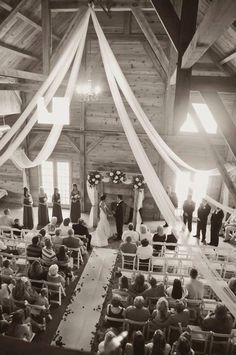 an overhead view of a wedding ceremony in a barn