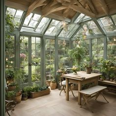 a room filled with lots of green plants and potted plants on top of wooden tables