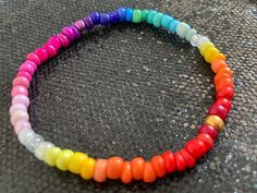 Stunning graduated rainbow multi coloured seed bead bracelet handmade with ❤️and lots of positive vibes by me. The bracelet is made with 4 mm glass beads on strong clear beading elastic.  The bracelet shown measures 19 cm. Should you be blessed with larger or smaller wrists please just leave me a message with your order indicating the size required & I shall happily make you a custom fit. Supplied tissue wrapped in a free gift bag. Rainbow Spiritual Bracelets For Festivals, Spiritual Multicolor Friendship Bracelets With 8mm Beads, Spiritual Rainbow Bracelets For Festivals, Adjustable Rainbow Bracelets With 8mm Beads, Casual Rainbow Bracelets With 8mm Beads, Adjustable Rainbow Stretch Bracelet Spiritual, Adjustable Rainbow Stretch Bracelet, Spiritual Style, Spiritual Beaded Rainbow Friendship Bracelets, Spiritual Rainbow Beaded Friendship Bracelet