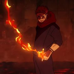 an anime character holding a fire ball in his right hand and wearing a hoodie