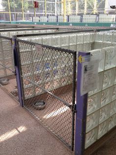 several metal cages with glass blocks behind them