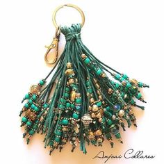 a green key chain with lots of beads on it