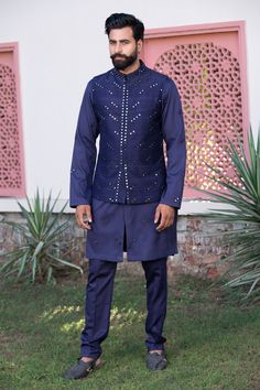 Blue nehru jacket with mirror, resham embroidery and concealed placket. Paired with kurta and pyjama.
Components: 3
Pattern: Embroidered
Type Of Work: Mirror
Neckline: Mandarin collar
Sleeve Type: Kurta: Full, Jacket: Sleeveless
Fabric: Russian Silk, Handloom Silk
Color: Blue
Other Details: 
Concealed placket
Side slits
Occasion: Wedding - Aza Fashions Dash And Dot, Kurta Set For Men, Nehru Jacket, Nehru Jackets, Groom Wear, Pajama Pant, Embroidered Applique, Fashion App, Kurta Set