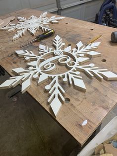 the snowflakes are cut out and ready to be put into woodwork