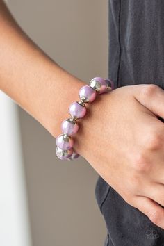 Capped in silver fittings, oversized purple pearls are threaded along a stretchy band around the wrist for a refined look.

 Sold as one individual bracelet. Bedazzled Jewelry, One Woman Show, Sparkle Bracelet, Purple Bracelet, Purple Pearl, Paparazzi Accessories, Band Bracelet, Stretchy Bracelets, Affordable Jewelry