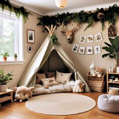 a child's room with a teepee tent and stuffed animals