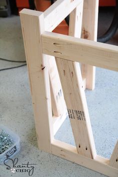 the frame is made from wood and ready to be put into an outdoor planter