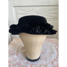 Chic vintage 1940s black ruched women's hat. Made of luxurious velvet and satin, the hat is a timeless piece reflecting the elegance and sophistication of the era. Ideal for vintage fashion enthusiasts. The brand inside Is Mr Sheldon. The outside of the hat is velvet and satin. The inside form is felted wool. It also says Picardy body Made in France. The circumference of the hat is approximately 20.25". The hat is clean and free of holes and in great wearable vintage condition. Free shipping to the lower 48 USa only.  * 1940s vintage hat * High-quality velvet and satin material * Ruched design for unique style * Black color for versatile pairing * Perfect for vintage fashion lovers Size: Womens 20.25" Condition: Pre-Owned Elegant Wide Brim Hat For Vintage Fashion, Vintage Brimmed Costume Hat For Formal Occasions, Vintage Brimmed Top Hat For Party, Vintage Brimmed Evening Hat, Vintage Short Brim Top Hat For Evening, Vintage Mini Hats For Evening In Winter, Victorian Cloche Hat For Evening, Vintage Short Brim Evening Hat, Fitted Vintage Bonnet