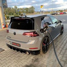 an electric car plugged in to a charging station