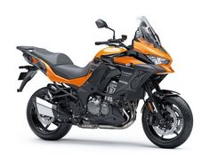 an orange and black motorcycle is shown on a white background