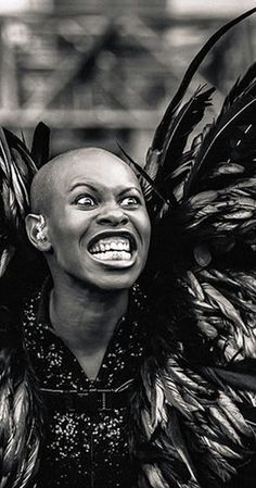 a woman with large feathers on her head