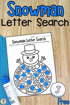 a snowman letter search is on the table next to a blue and white tie