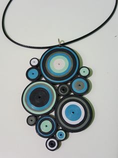 a black and blue necklace with circles on it