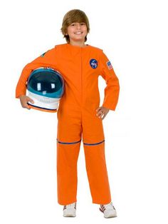 a boy in an orange space suit holding a helmet